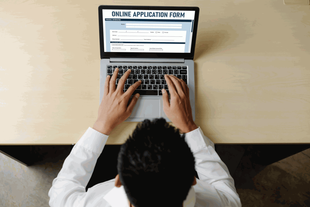 A Man filling out the Bahrain eVisa Application Form