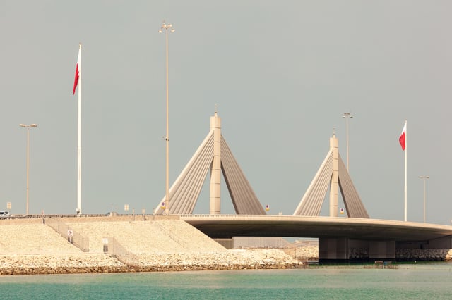 Causeway bridge with Bahrain flags