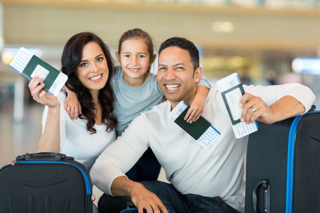Happy family with passports and tickets