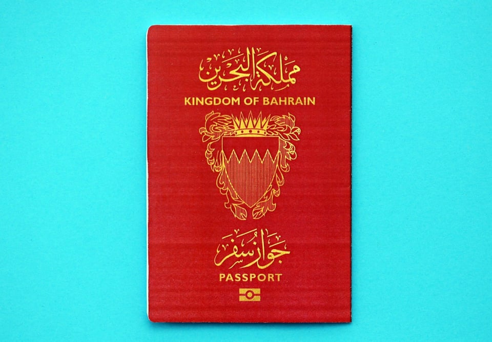 Bahraini Passport On A Light Blue Background